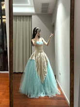 Champagne-colored strapless, fitted, long ball gown with a lake blue skirt R8853