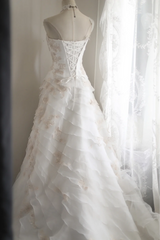 White strapless embroidered A-line ball gown with a fitted waist and full skirt R6771